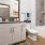 well lit bathroom with tub